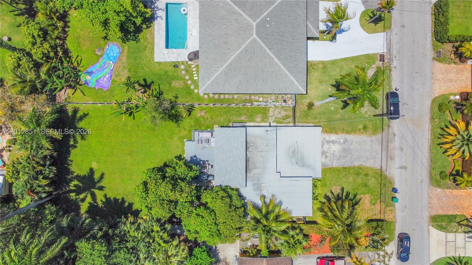 360 Northeast 116th Street Miami, FL 33161 - Photo 27 of 29 an aerial view of residential house with pool and garden