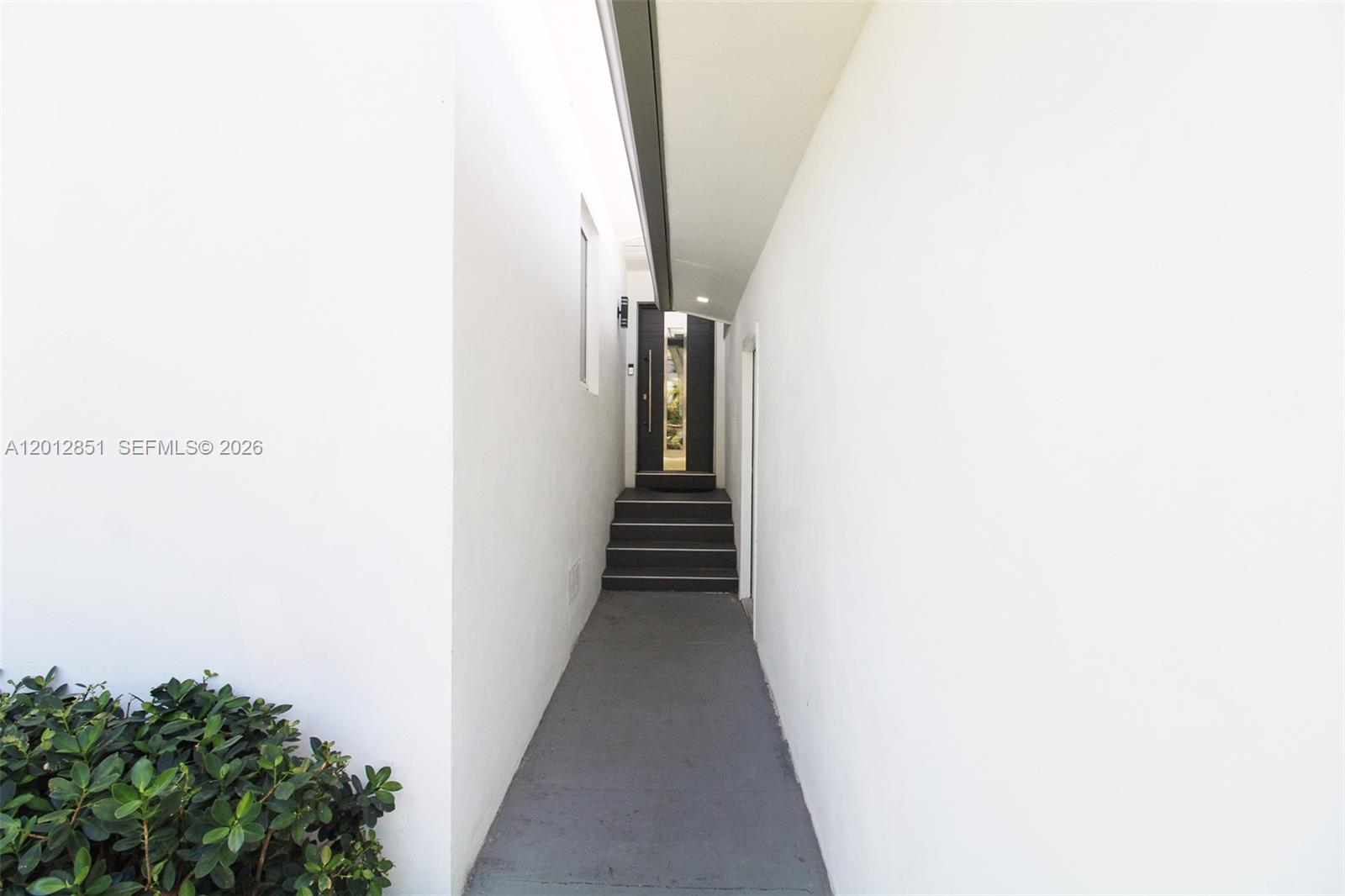 360 Northeast 116th Street Miami, FL 33161 - Photo 29 of 29 a view of a hallway with stairs