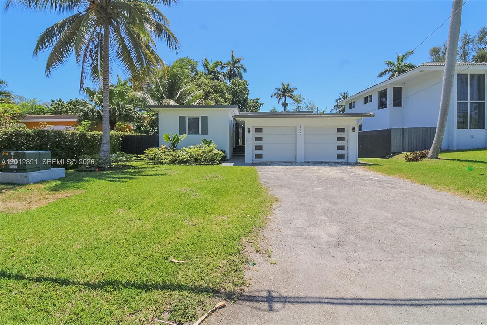 360 Northeast 116th Street Miami, FL 33161 - Photo 5 of 29 a front view of house with yard and green space