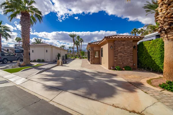 a view of a house with a yard and tree s