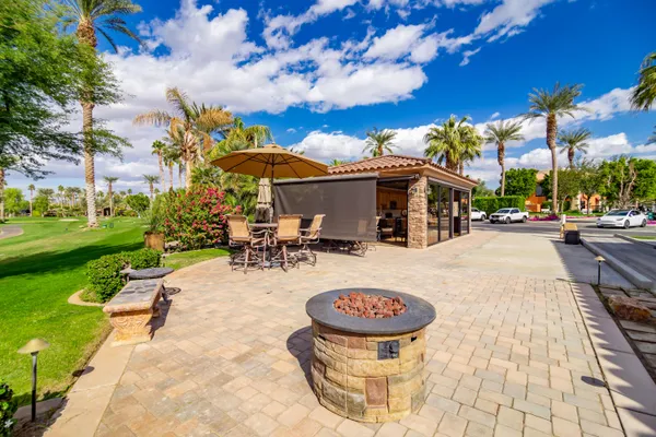 a view of a house with a yard porch and sitting area