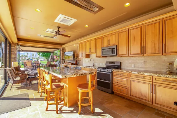a very nice looking kitchen with a large window