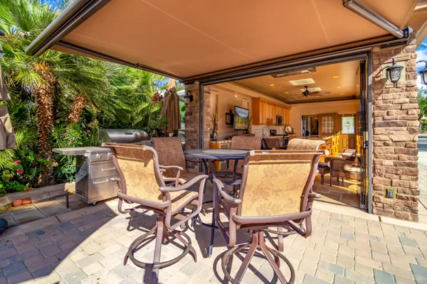 a view of a swimming pool and lounge chairs