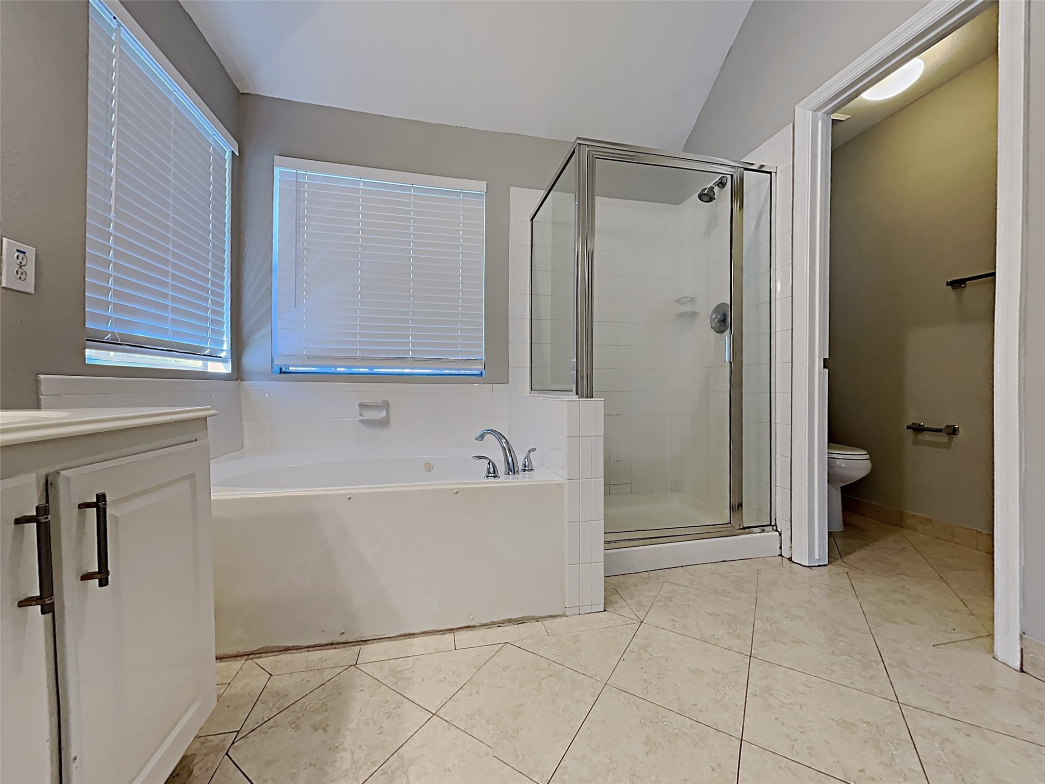85 Summer Lark Place Spring, TX 77382 - Photo 19 of 20 a bathroom with a bathtub and a shower