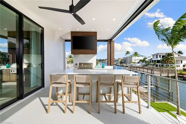a kitchen with a table chairs and entryway