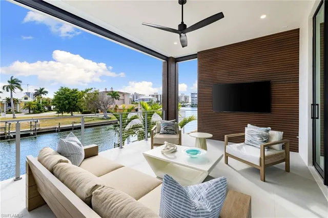 a outdoor living space with furniture and a fireplace