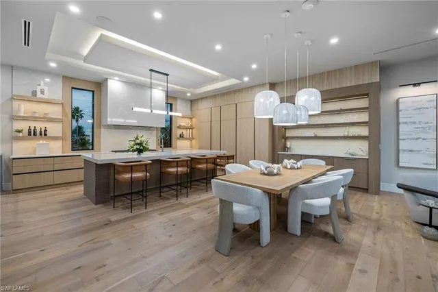 a kitchen with a table and chairs in it