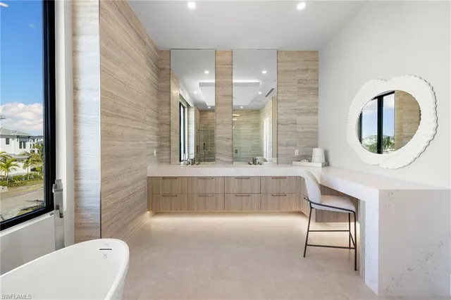 a bathroom with a bathtub and a sink