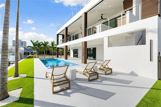 a view of a patio with a table and chairs