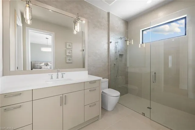 a bathroom with a double vanity sink mirror and shower