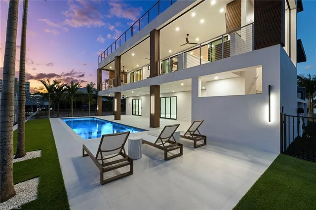 a view of a two chairs in the patio