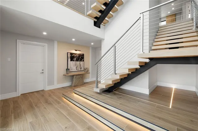 a view of a hallway view with staircase