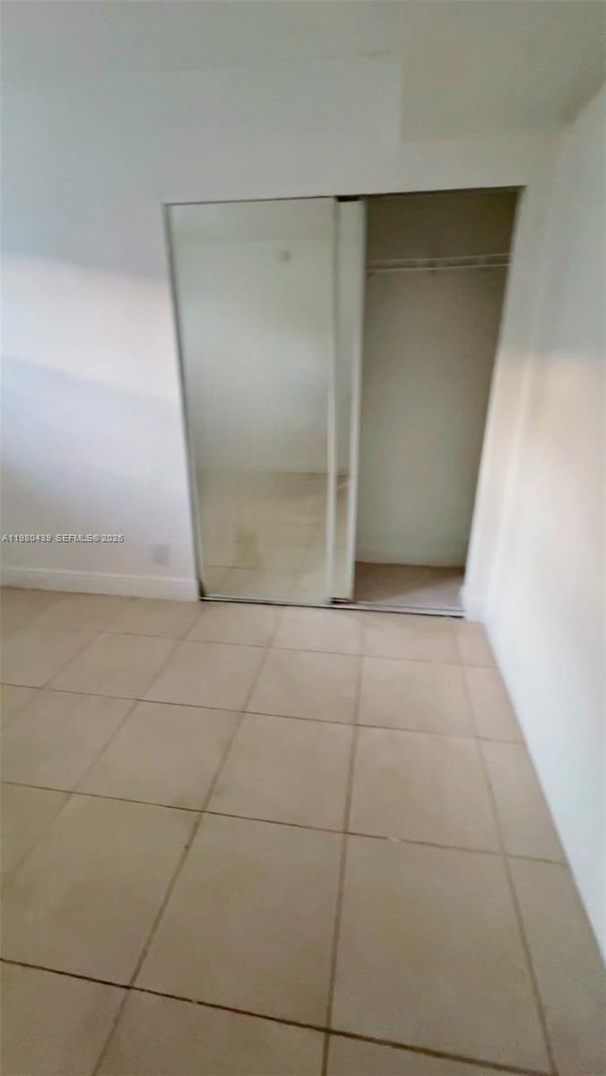 4435 Treehouse Lane, Unit H Tamarac, FL 33319 - Photo 11 of 18 a view of a room with an empty space