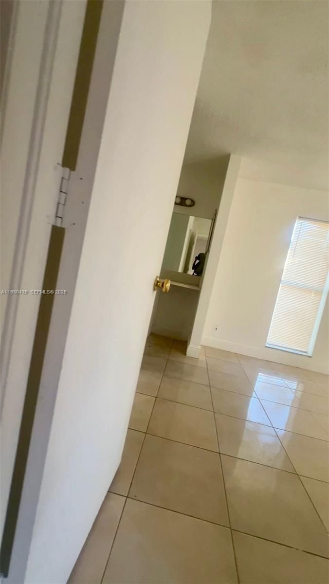 4435 Treehouse Lane, Unit H Tamarac, FL 33319 - Photo 15 of 18 a bathroom with a sink