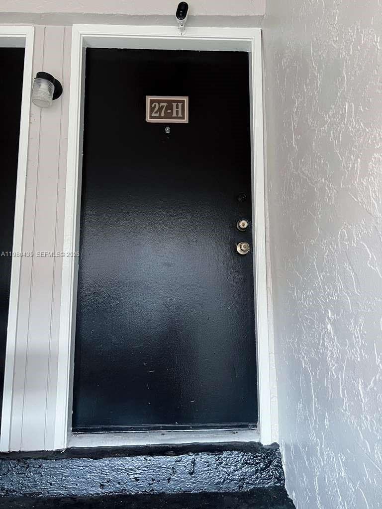 4435 Treehouse Lane, Unit H Tamarac, FL 33319 - Photo 4 of 18 a view of cupboard