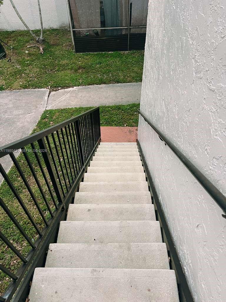 4435 Treehouse Lane, Unit H Tamarac, FL 33319 - Photo 9 of 18 a view of balcony with wooden floor