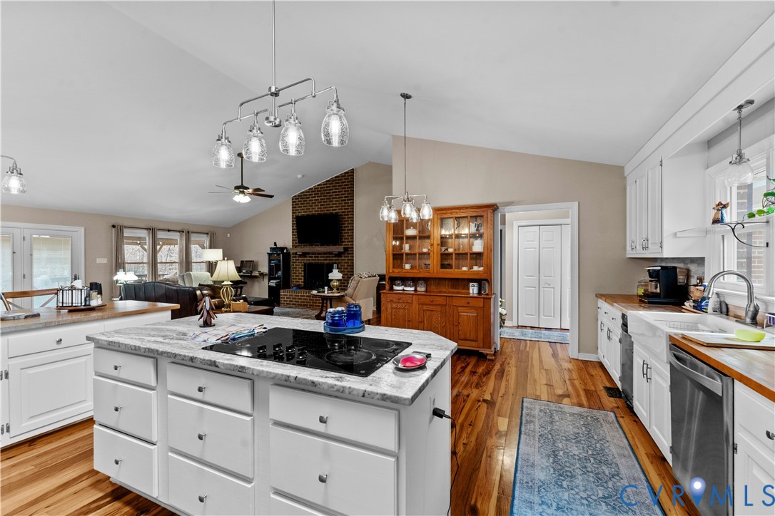 1937 Woodberry Mill Road Powhatan, VA 23139 - Photo 13 of 60 a kitchen with stove cabinets and chandelier