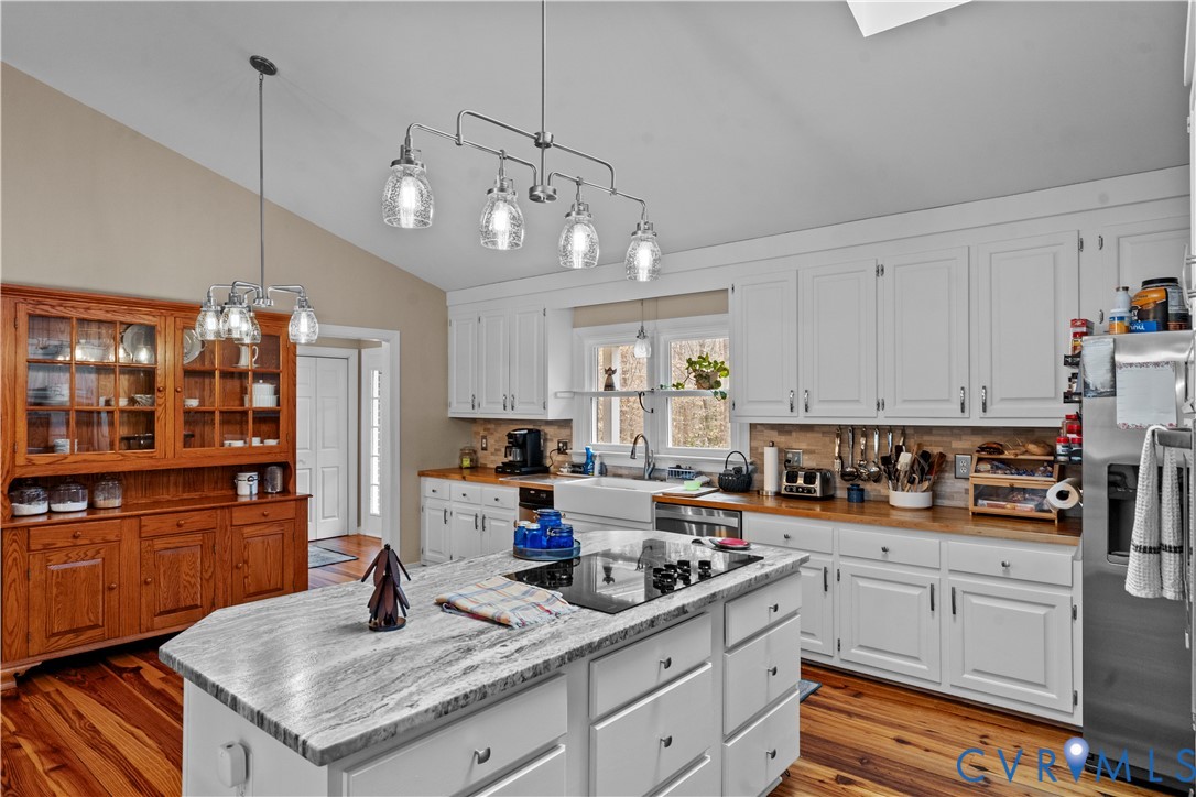 1937 Woodberry Mill Road Powhatan, VA 23139 - Photo 14 of 60 a kitchen with granite countertop lots of counter top space and cabinets