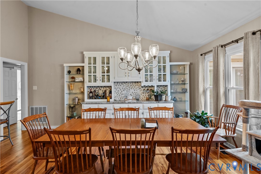 1937 Woodberry Mill Road Powhatan, VA 23139 - Photo 23 of 60 a view of a dining room with furniture and chandelier