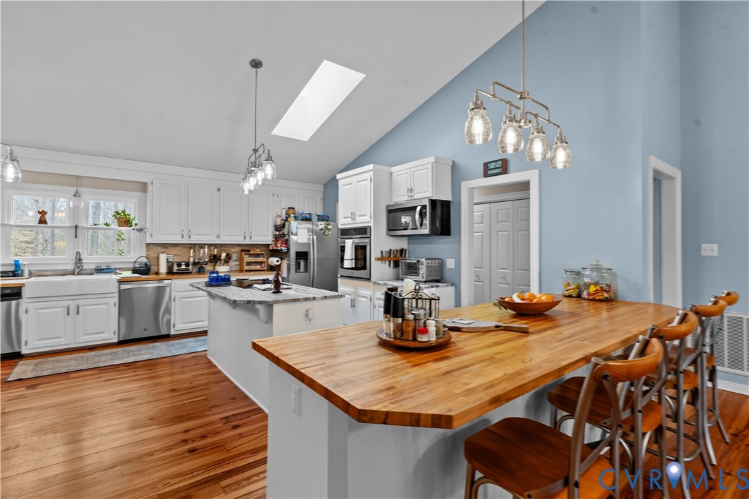 1937 Woodberry Mill Road Powhatan, VA 23139 - Photo 24 of 60 a kitchen with a table and chairs in it