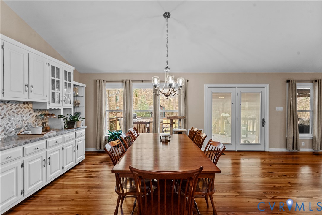 1937 Woodberry Mill Road Powhatan, VA 23139 - Photo 25 of 60 a view of a a dining room with furniture window and wooden floor