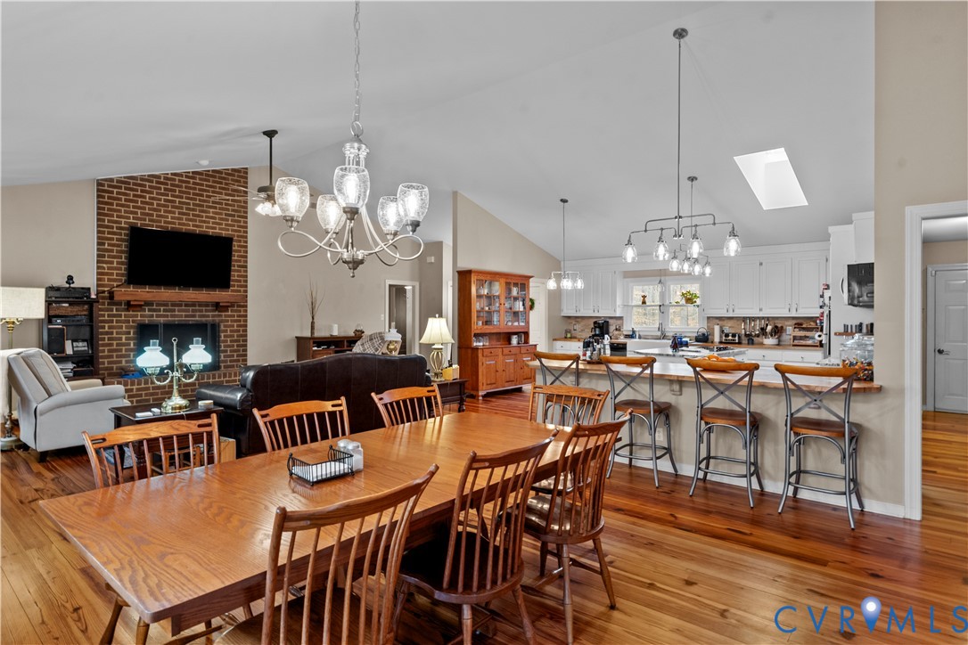1937 Woodberry Mill Road Powhatan, VA 23139 - Photo 27 of 60 a view of a dining room and livingroom with furniture wooden floor a chandelier and a chandelier