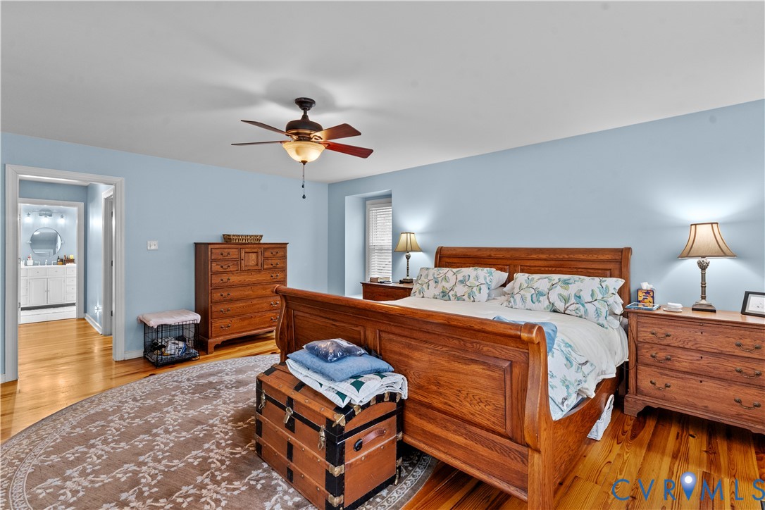 1937 Woodberry Mill Road Powhatan, VA 23139 - Photo 32 of 60 a bedroom with a bed and wooden floor