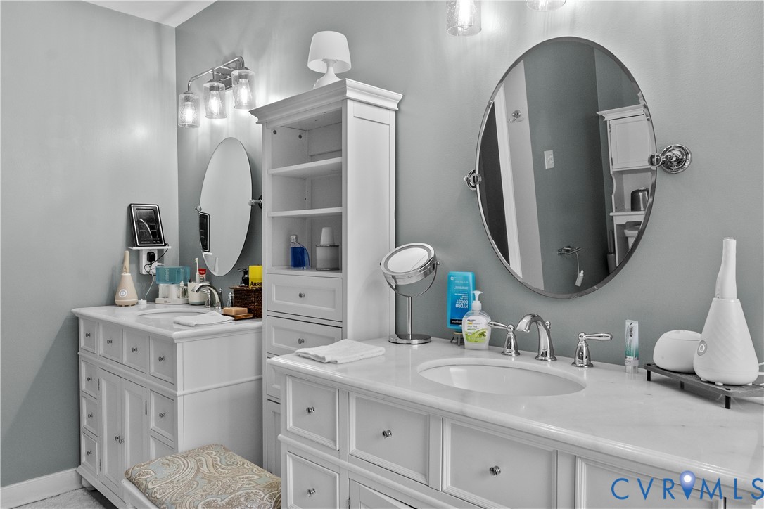 1937 Woodberry Mill Road Powhatan, VA 23139 - Photo 37 of 60 a bathroom with double vanity sinks and a mirror