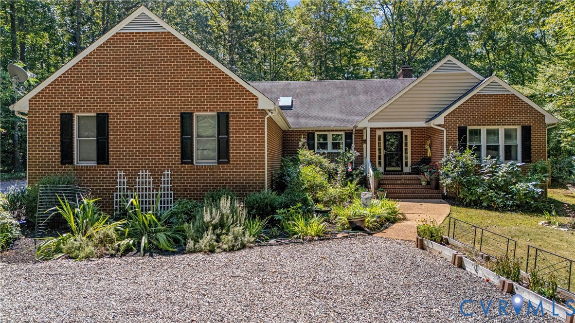 1937 Woodberry Mill Road Powhatan, VA 23139 - Photo 4 of 60 a front view of a house with a yard