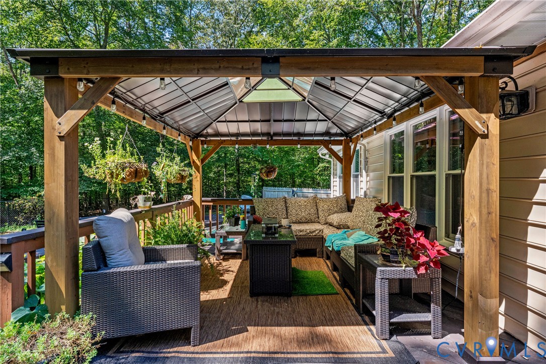1937 Woodberry Mill Road Powhatan, VA 23139 - Photo 47 of 60 an outdoor living room with furniture and garden view