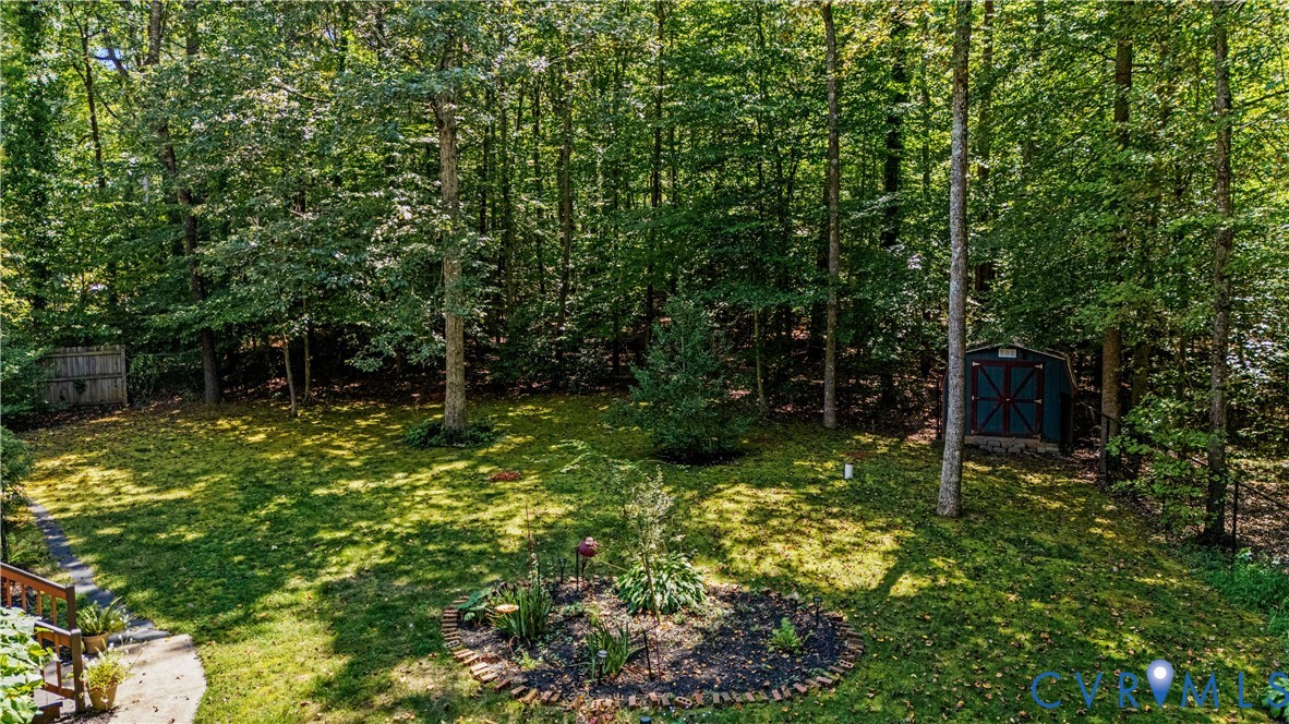 1937 Woodberry Mill Road Powhatan, VA 23139 - Photo 50 of 60 a backyard of a house with lots of green space