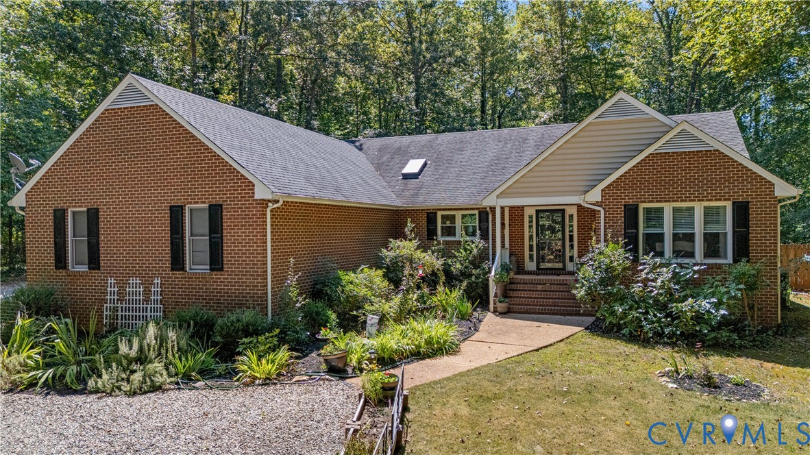 1937 Woodberry Mill Road Powhatan, VA 23139 - Photo 5 of 60 a front view of a house with a yard and potted plants