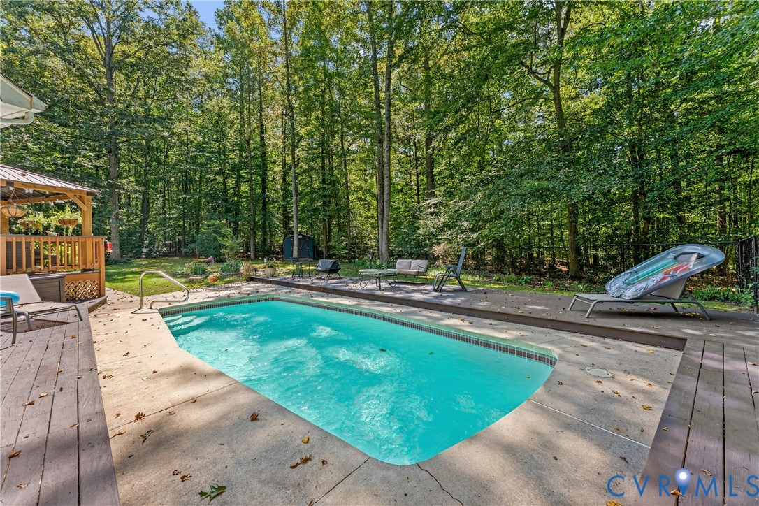 1937 Woodberry Mill Road Powhatan, VA 23139 - Photo 52 of 60 a view of a swimming pool with a patio
