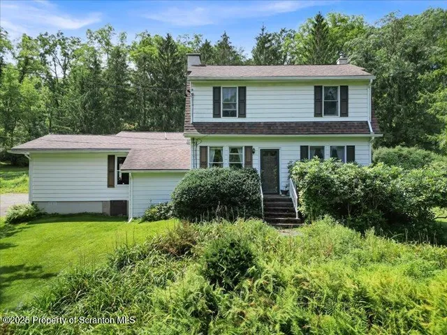 a view of a garden in a backyard of a house