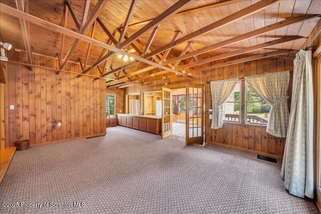 a bedroom with a bed and a view of bathroom