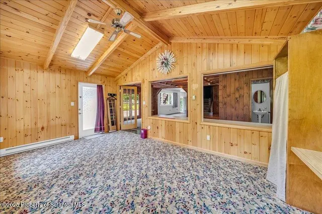 a view of empty room with furniture and closet