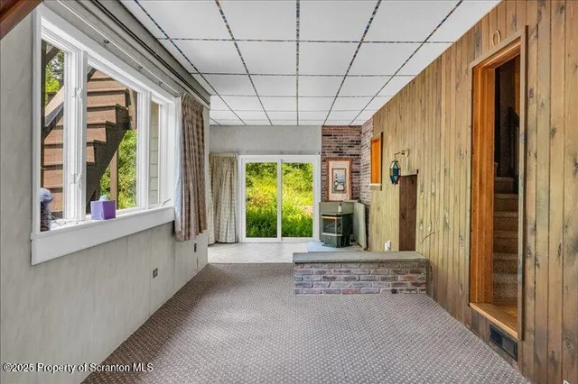 a view of a room with furniture and a window