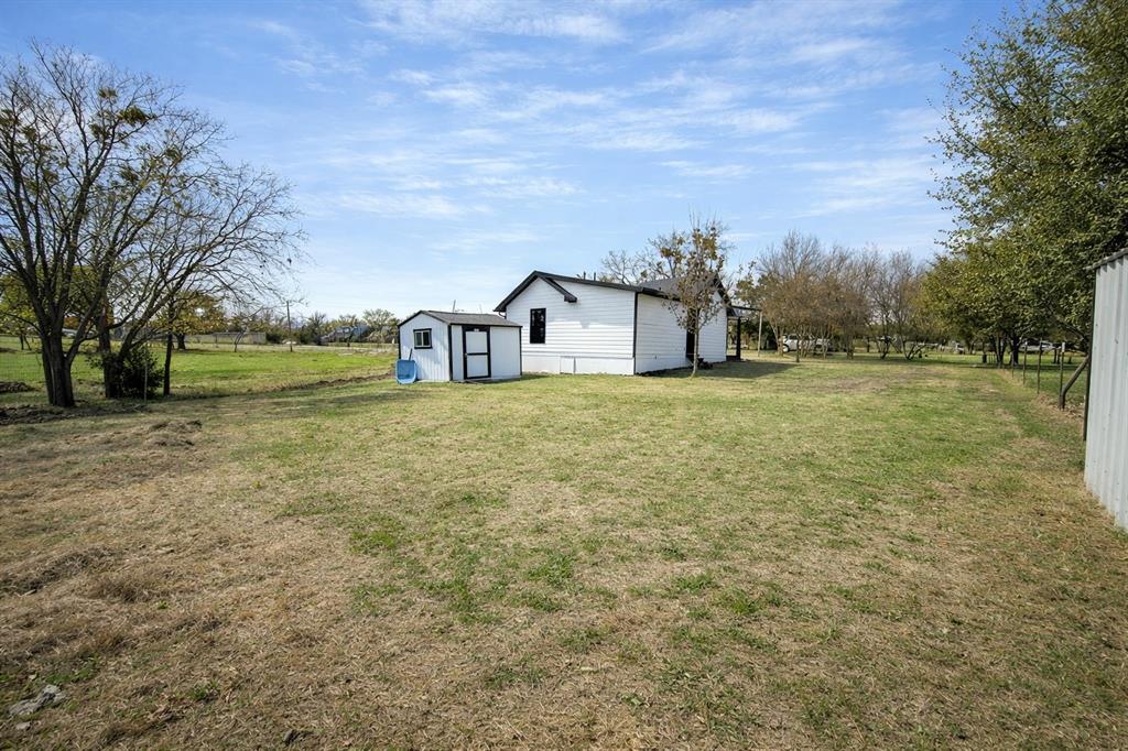 211 Crockett Street Rice, TX 75155 - Photo 11 of 12 a view of a large garden with large trees