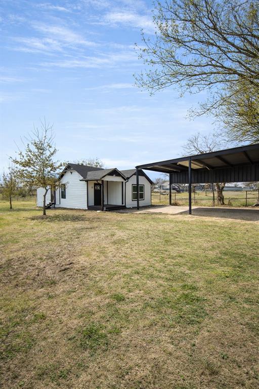 211 Crockett Street Rice, TX 75155 - Photo 2 of 12 a front view of house with yard