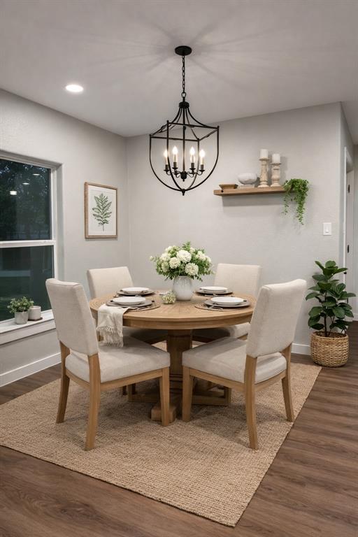 211 Crockett Street Rice, TX 75155 - Photo 5 of 12 a view of a dining room with furniture wooden floor and chandelier