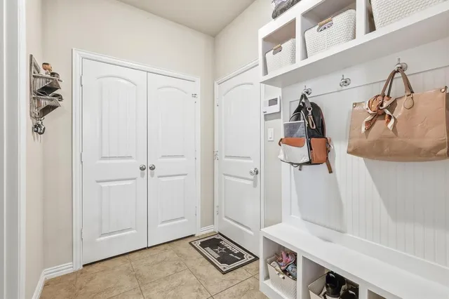 a view of an entryway with wooden floor