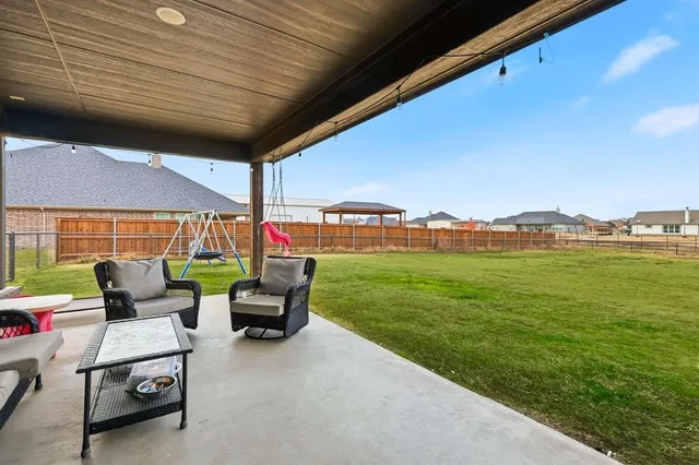 a outdoor living space with furniture and garden view