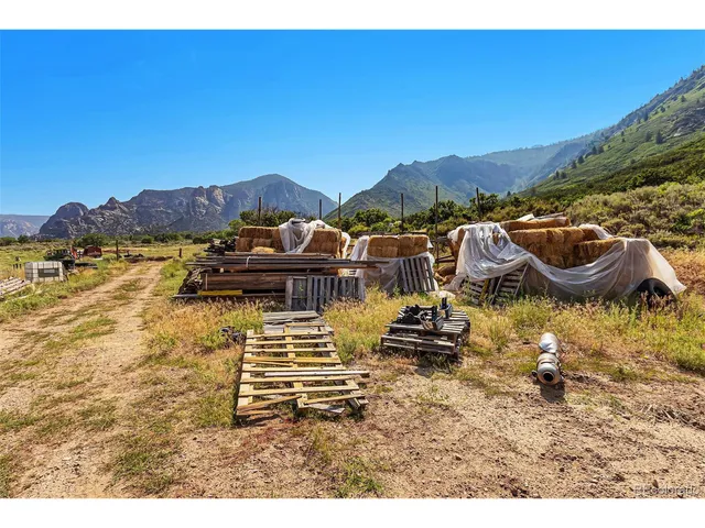 a view of swimming pool with a table and chairs