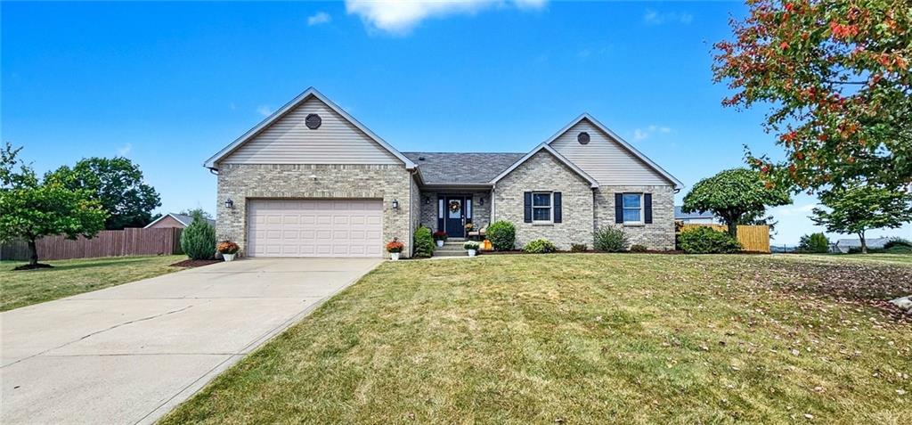 227 Meadow Spring Road Greensburg, PA 15601 - Photo 1 of 50 a front view of a house with a yard and garage