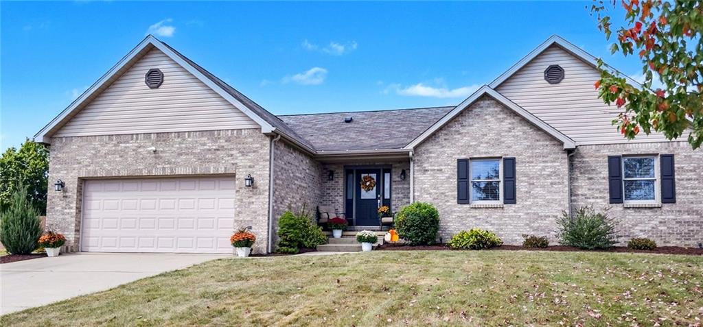 227 Meadow Spring Road Greensburg, PA 15601 - Photo 2 of 50 a front view of a house with garden