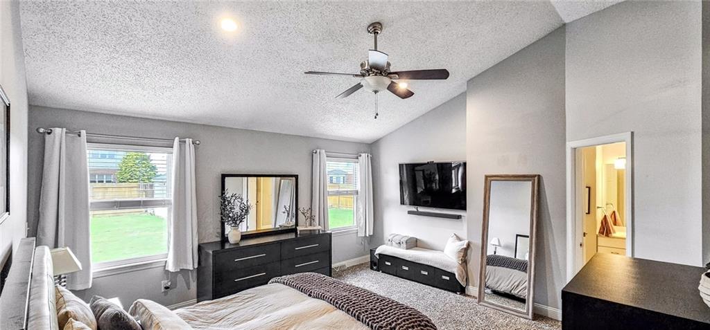 227 Meadow Spring Road Greensburg, PA 15601 - Photo 21 of 50 a bedroom with a bed a flat screen tv and a couch