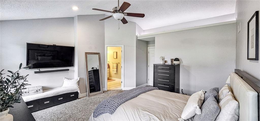 227 Meadow Spring Road Greensburg, PA 15601 - Photo 22 of 50 a bedroom with a bed and a flat screen tv