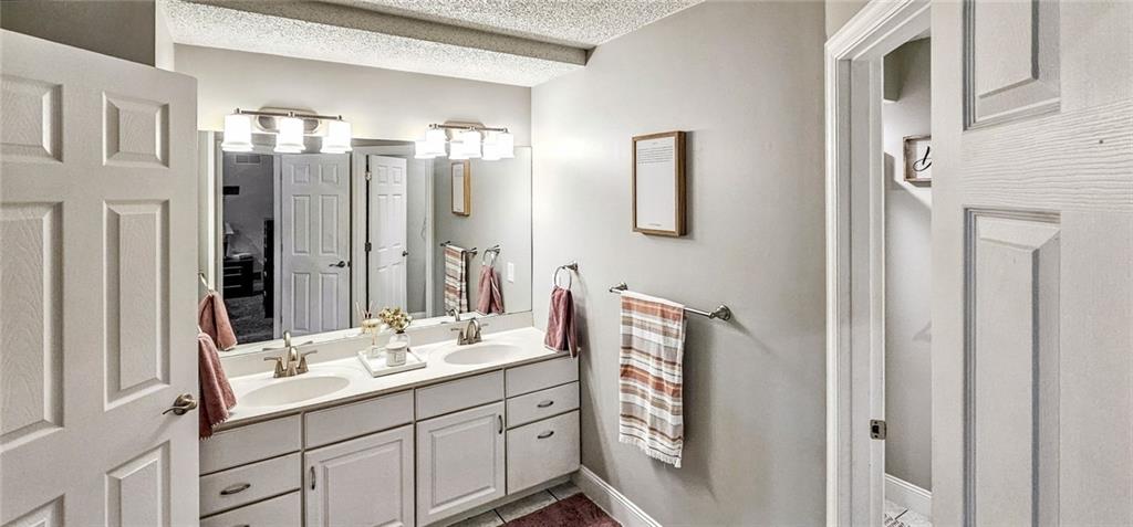 227 Meadow Spring Road Greensburg, PA 15601 - Photo 23 of 50 a bathroom with a double vanity sink mirror and double