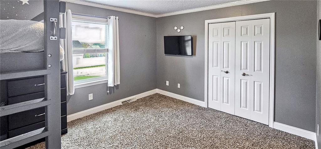 227 Meadow Spring Road Greensburg, PA 15601 - Photo 34 of 50 a view of an empty room with wooden floor and a window
