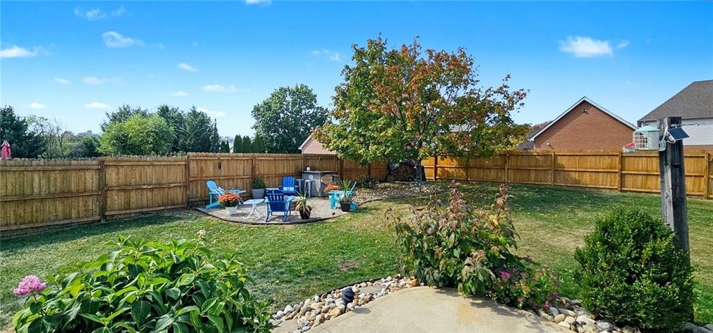 227 Meadow Spring Road Greensburg, PA 15601 - Photo 41 of 50 a view of backyard with wooden fence and sitting area
